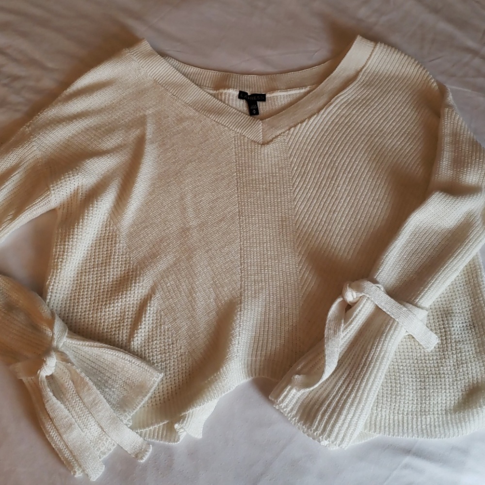 Cream sweater with slit in back